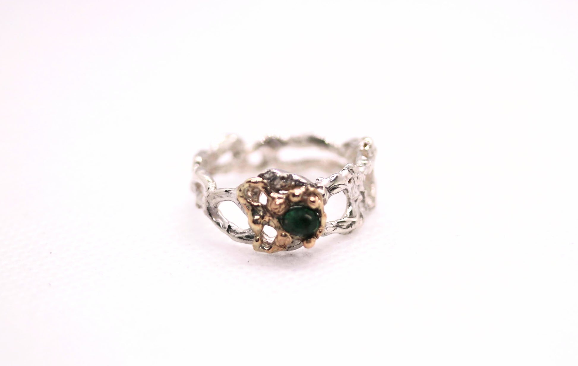 silver gold emerald ring
