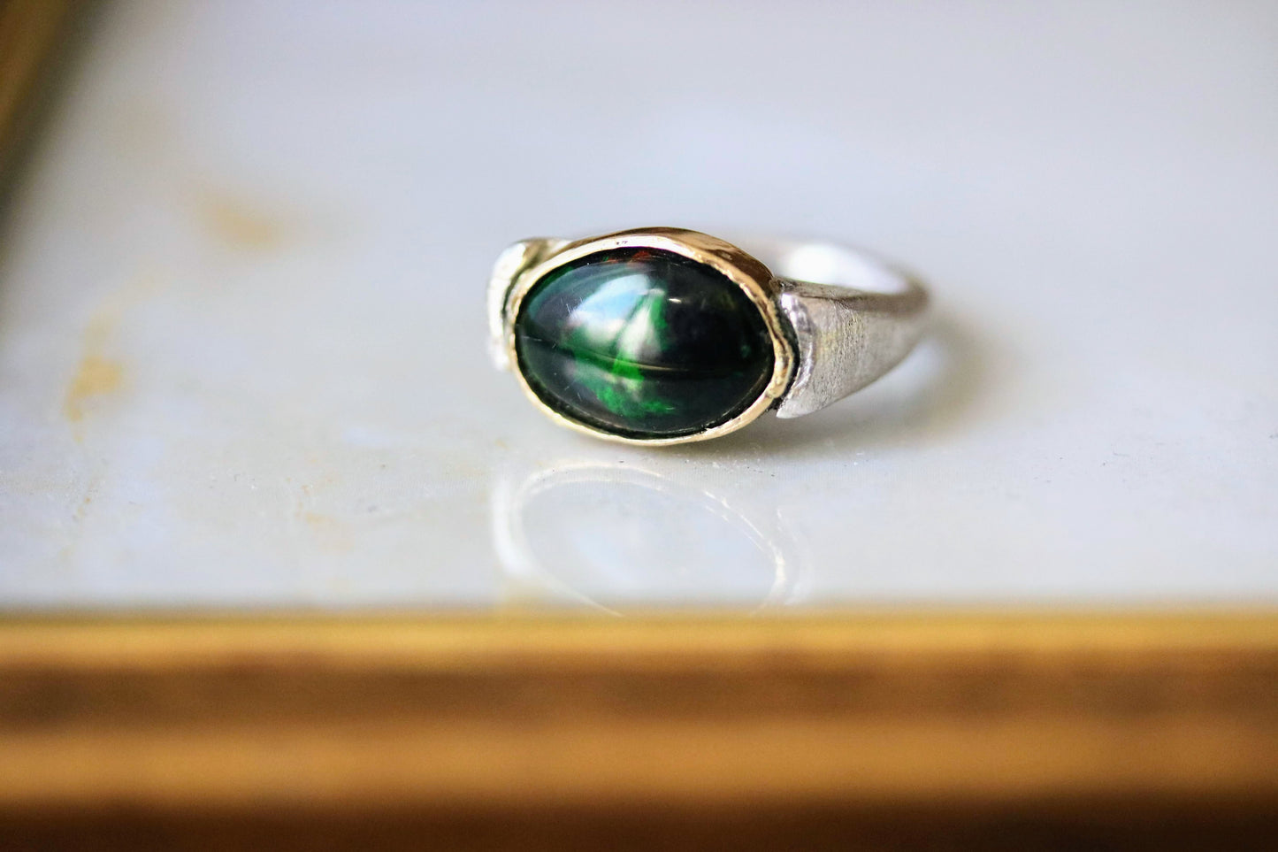 black opal gold and silver ring
