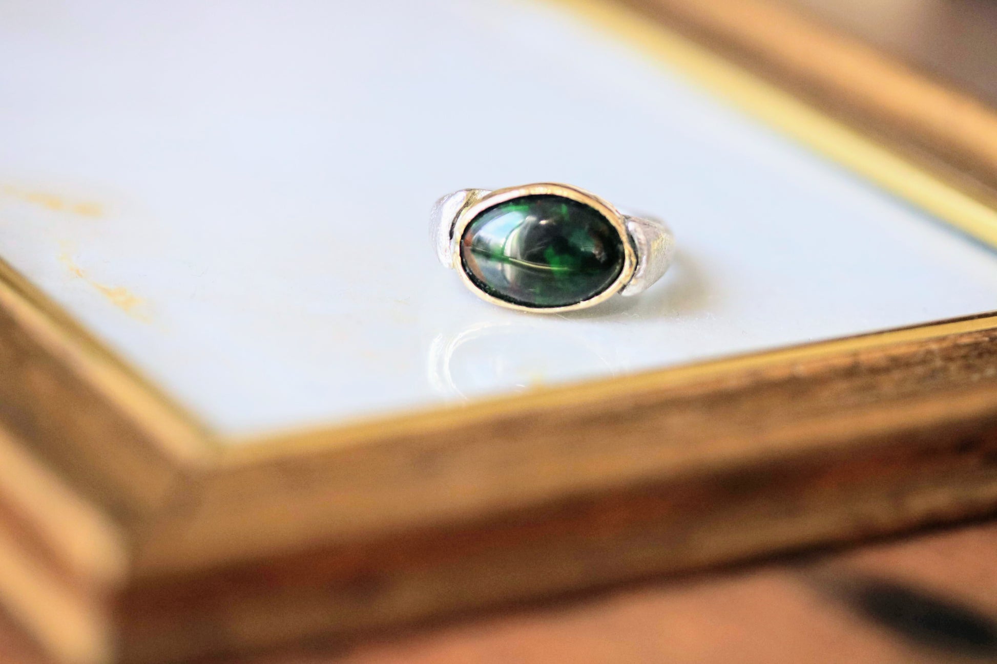 black opal gold and silver ring
